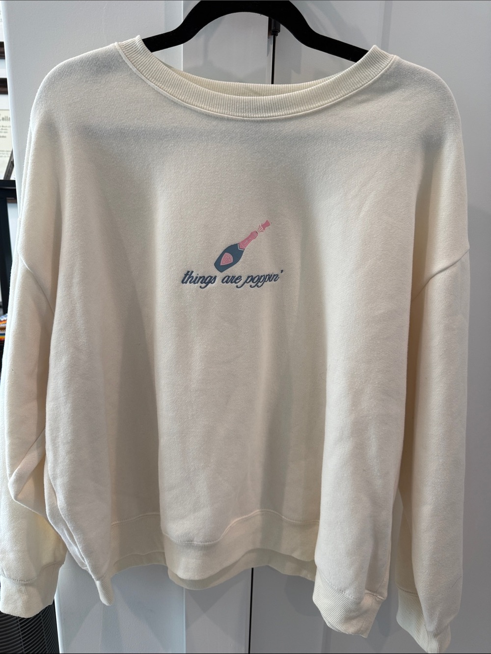 Cream 'things are poppin'' Sweatshirt with Champagne Graphic